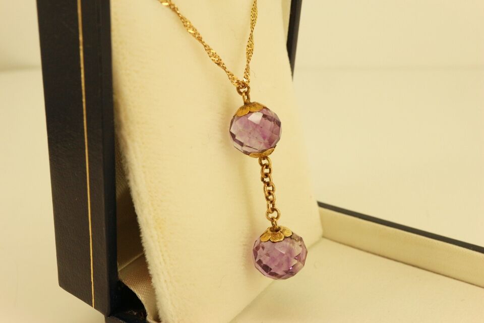 gold necklace with amethysts