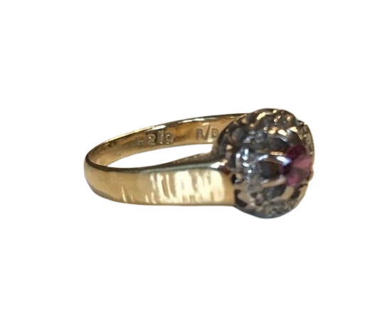 an 18 carat gold ring with diamonds and rubies